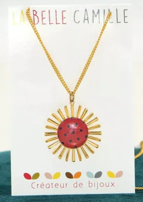 Collier chainette or en forme de soleil femme à pois